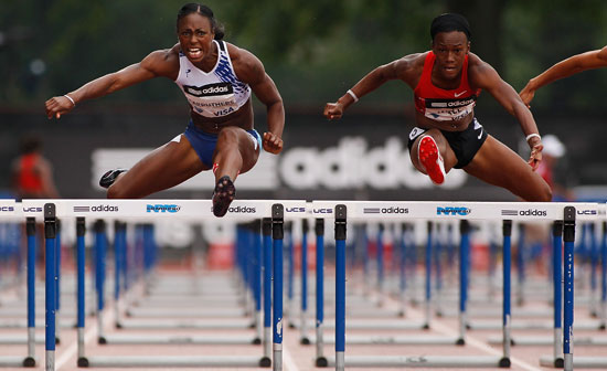 Danielle Carruthers of the USA en route to winning the 100m Women’s Hurdle against Kellie Wells of the USA looks on during the adidas Grand Prix at Icahn Stadium on June 11, 2011 in New York City. (Photo by: Mike Stobe/Getty Images)