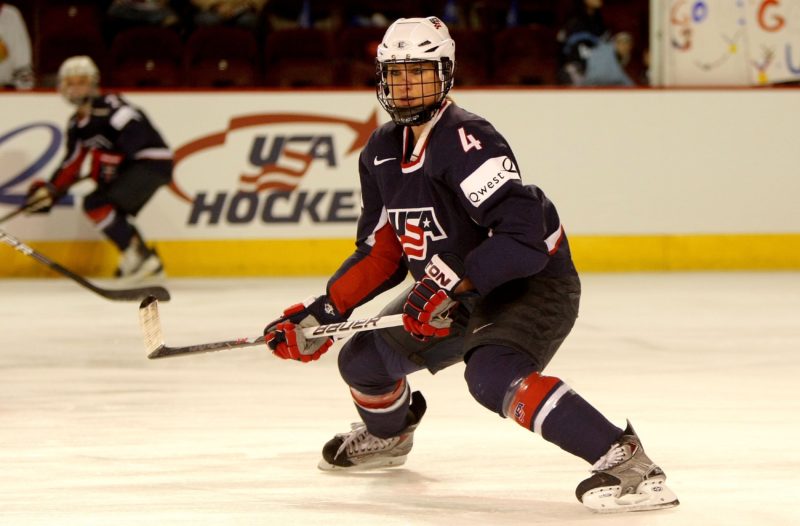 Angela Ruggiero playing hockey for team USA