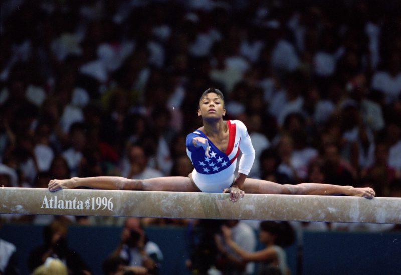 Dominique Dawes performing on the beam for Team USA at the 1996 Olympics.