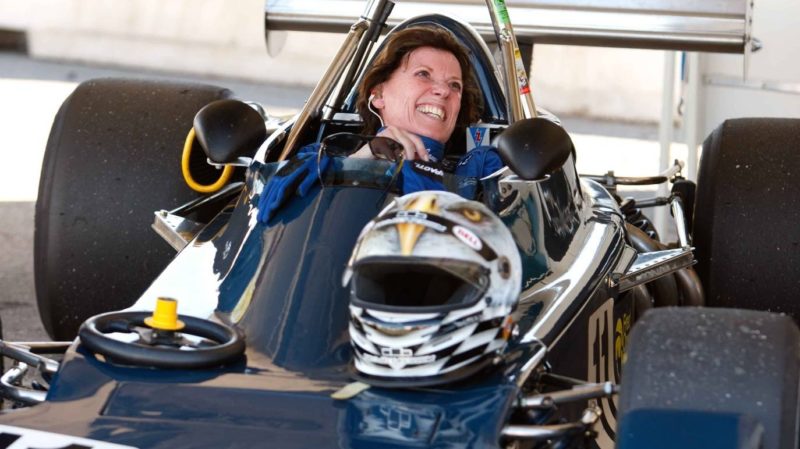 Lyn St. James sitting in a Formula 1 car