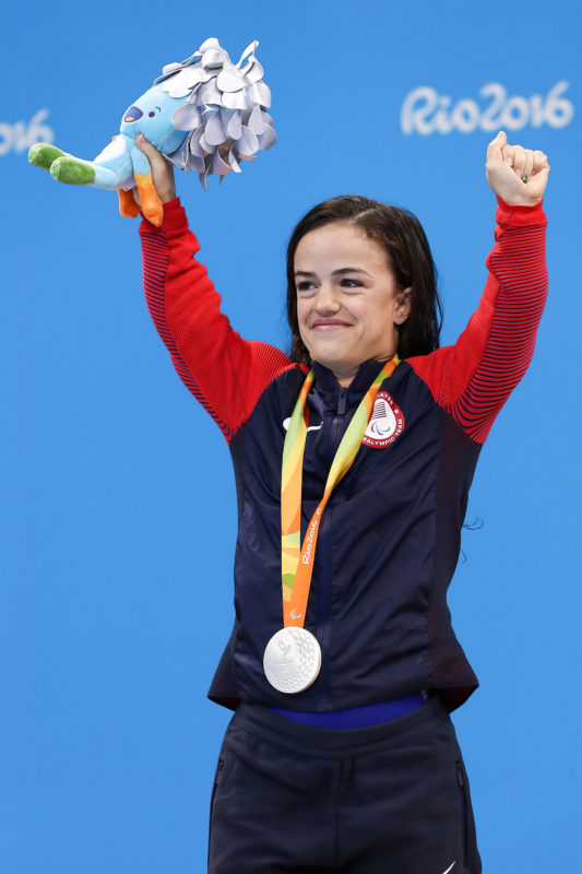 Sophia Herzog celebrates her silver medal on the podium at the 2016 Paralympic Games.
