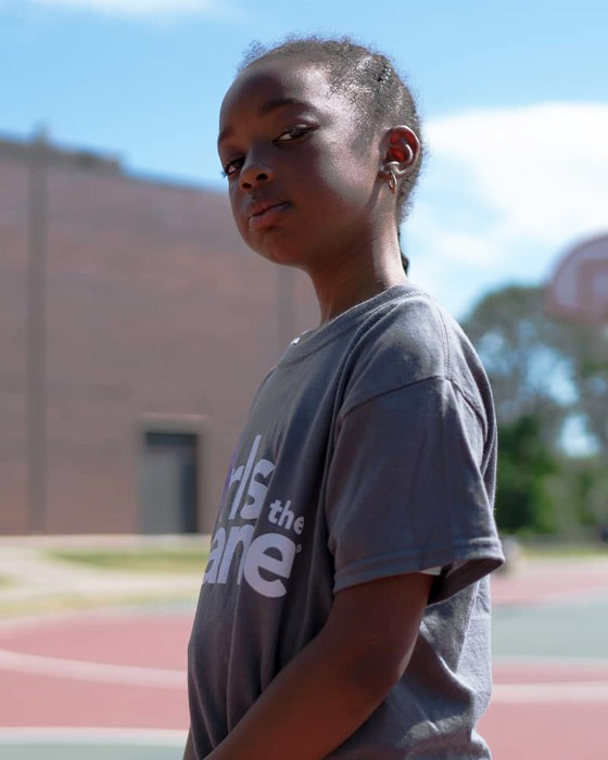 Young Athlete from Chicago - Basketball court in background