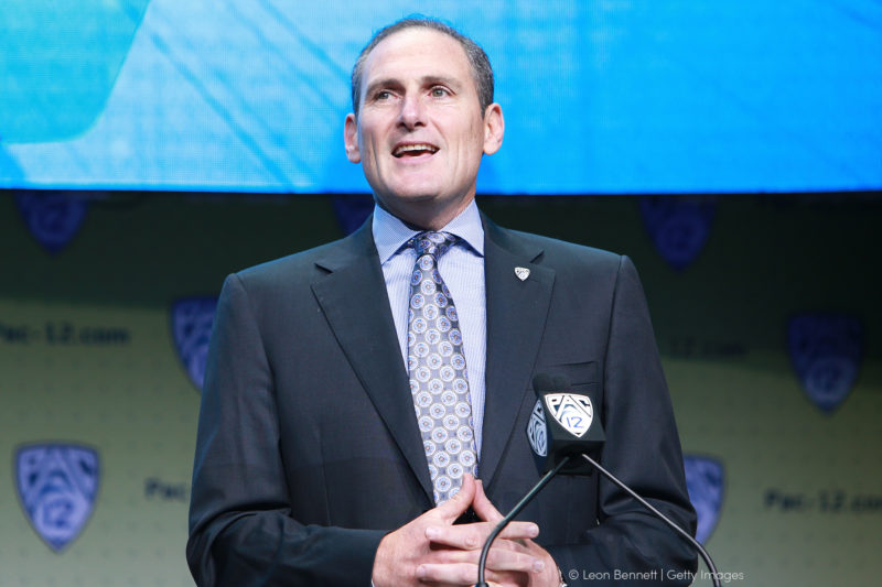 Former Pac 12 Commissioner Larry Scott speaking on stage at Pac 12 event
