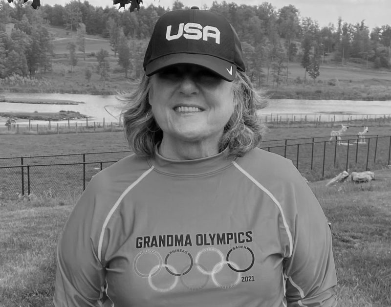 Headshot of WSF donor Nancy Beren wearing a USA cap and Grandma Olympics tea