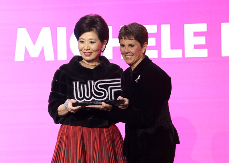 (L-R) Michele Kang accepts the Billie Jean King Leadership Award from Ilana Kloss onstage during the 2025 Women's Sports Foundation's Annual Salute To Women In Sports at Cipriani Wall Street on October 22, 2025 in New York City. 