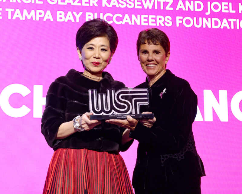 Michele Kang (L) accepts the 2025 Billie Jean King Leadership Award from Ilana Kloss (R) onstage during the 2025 Women's Sports Foundation's Annual Salute To Women In Sports awards gala.