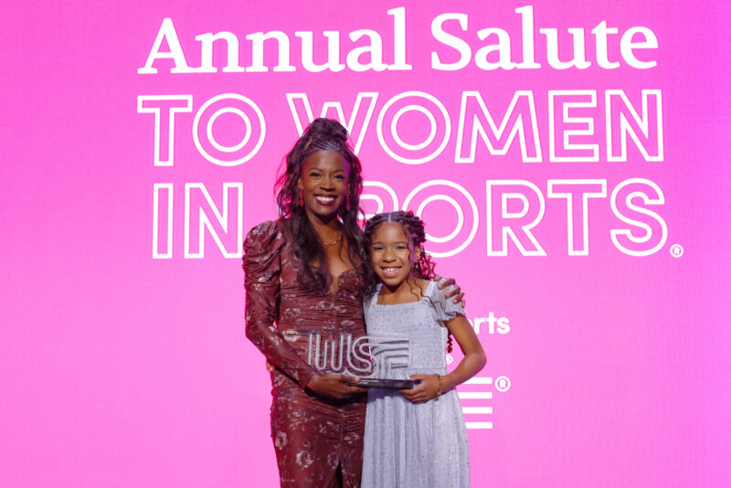 Alysia Montaño (L) accepts the Wilma Rudolph Courage Award from Linnéa Montaño (R) onstage during the 2025 Women's Sports Foundation's Annual Salute To Women In Sports awards gala.